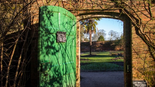 Looking through a gate into the flower garden at Calke Abbey